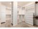 Spacious walk-in closet with built-in shelves and drawers at 9312 E Arrowvale Dr, Sun Lakes, AZ 85248