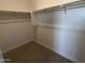 Spacious walk-in closet with double hanging rods at 9408 E Supernova Dr, Mesa, AZ 85212