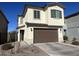 Two-story house with brown garage door and landscaping at 9408 E Supernova Dr, Mesa, AZ 85212