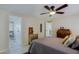 Comfortable bedroom with ceiling fan, dresser, and neutral decor at 9501 E Broadway Rd # 140, Mesa, AZ 85208