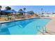 Inviting community swimming pool with ample seating at 9501 E Broadway Rd # 140, Mesa, AZ 85208