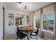 Dining area with a round table and four leather chairs at 9501 E Broadway Rd # 140, Mesa, AZ 85208