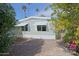 House exterior with gravel landscaping and palm trees at 9501 E Broadway Rd # 140, Mesa, AZ 85208