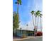 Mobile home exterior with landscaping and palm trees at 9501 E Broadway Rd # 140, Mesa, AZ 85208