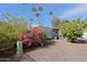 Home exterior with blooming bougainvillea and citrus trees at 9501 E Broadway Rd # 140, Mesa, AZ 85208