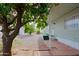 Side yard with a citrus tree and a flagstone walkway at 9501 E Broadway Rd # 140, Mesa, AZ 85208