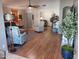 Open living room featuring hardwood floors, a cozy seating area, and abundant natural light at 10728 W Irma Ln, Sun City, AZ 85373