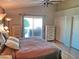 Main bedroom with large windows, plenty of closet space, and access to a private patio at 10728 W Irma Ln, Sun City, AZ 85373