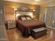 Spacious main bedroom with wood-look floors and lots of natural light at 10728 W Irma Ln, Sun City, AZ 85373