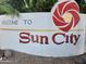 Welcome to Sun City entrance sign with mosaic tile design at 10845 W Hatcher Rd, Sun City, AZ 85351