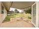 Covered patio with seating area overlooking yard at 10845 W Hatcher Rd, Sun City, AZ 85351