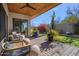 Relaxing backyard patio with seating and desert landscaping at 10929 E North Ln, Scottsdale, AZ 85259