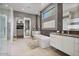 Spa-like Primary bathroom with soaking tub, walk-in shower, and dual sinks at 10929 E North Ln, Scottsdale, AZ 85259