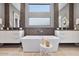 Elegant bathroom with a freestanding tub and double vanity at 10929 E North Ln, Scottsdale, AZ 85259