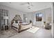 Relaxing bedroom with an ornate bed frame and large windows at 10929 E North Ln, Scottsdale, AZ 85259