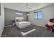 Spacious bedroom with plush carpeting and a ceiling fan at 10929 E North Ln, Scottsdale, AZ 85259