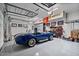 Spacious garage with overhead storage and a classic car at 10929 E North Ln, Scottsdale, AZ 85259
