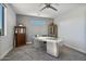 Bright home office features a large metal desk, built-in shelving, and carpet flooring at 10929 E North Ln, Scottsdale, AZ 85259