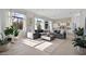 Open concept living area with large windows and modern furniture at 10929 E North Ln, Scottsdale, AZ 85259