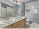 Clean bathroom with double sink and a shower at 11840 N 49Th Ave, Glendale, AZ 85304