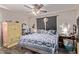 Bedroom with a queen bed, wooden armoire and ceiling fan at 11840 N 49Th Ave, Glendale, AZ 85304