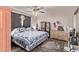 Main bedroom with a queen-size bed, dresser, and ceiling fan at 11840 N 49Th Ave, Glendale, AZ 85304