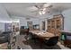 A cluttered dining room with a wooden table and chairs, and a large wooden cabinet at 11840 N 49Th Ave, Glendale, AZ 85304