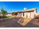 Backyard view of house with covered patio and grassy area at 1243 E Avenida Grande --, Casa Grande, AZ 85122