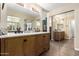 Bathroom with double vanity and mirrored closet at 1243 E Avenida Grande --, Casa Grande, AZ 85122