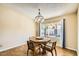 Bright dining area with a large window and wood table at 1243 E Avenida Grande --, Casa Grande, AZ 85122