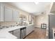 Updated kitchen with modern gray cabinets and stainless steel appliances at 1243 E Avenida Grande --, Casa Grande, AZ 85122