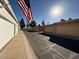 Row of garages in a residential complex under a clear sky at 1319 E Susan Ln, Tempe, AZ 85288