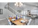 Charming dining room with wood table, gray walls, and a view of the living room at 1640 N Sawyer --, Mesa, AZ 85207