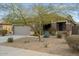 Single story home with landscaped front yard and attached two-car garage at 17639 W Buckhorn Dr, Goodyear, AZ 85338