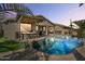 Inviting kidney-shaped pool with a large covered patio at 17639 W Buckhorn Dr, Goodyear, AZ 85338