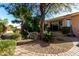 Landscaped backyard with mature trees and pathway at 17770 W Cottonwood Ln, Goodyear, AZ 85338