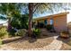 Landscaped backyard with mature trees and pathway at 17770 W Cottonwood Ln, Goodyear, AZ 85338