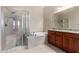 Bathroom with double vanity, soaking tub and shower at 17770 W Cottonwood Ln, Goodyear, AZ 85338