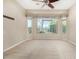 Bedroom with ceiling fan and large window at 17770 W Cottonwood Ln, Goodyear, AZ 85338