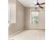 Spacious bedroom with ceiling fan and neutral carpeting at 17770 W Cottonwood Ln, Goodyear, AZ 85338