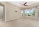 Bedroom with bay window and ceiling fan at 17770 W Cottonwood Ln, Goodyear, AZ 85338
