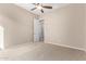Well-lit bedroom with ceiling fan and neutral decor at 17770 W Cottonwood Ln, Goodyear, AZ 85338