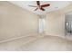 Bedroom with ceiling fan and access to bathroom at 17770 W Cottonwood Ln, Goodyear, AZ 85338