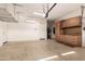 Spacious garage with built-in cabinets and overhead storage at 17770 W Cottonwood Ln, Goodyear, AZ 85338