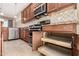 Well-equipped kitchen featuring pull-out drawers and wooden cabinetry at 17770 W Cottonwood Ln, Goodyear, AZ 85338