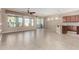 Bright living room with tile floors and access to backyard patio at 17770 W Cottonwood Ln, Goodyear, AZ 85338