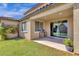 Covered patio with built-in grill and grassy backyard at 18749 W San Miguel Ave, Litchfield Park, AZ 85340