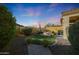 Landscaped backyard with fire pit and artificial turf at 2026 N Atwood --, Mesa, AZ 85207