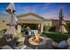 Landscaped backyard with a fire pit and seating area at 2026 N Atwood --, Mesa, AZ 85207