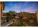 Relaxing backyard oasis with fire pit, patio furniture, and string lights at 2026 N Atwood --, Mesa, AZ 85207